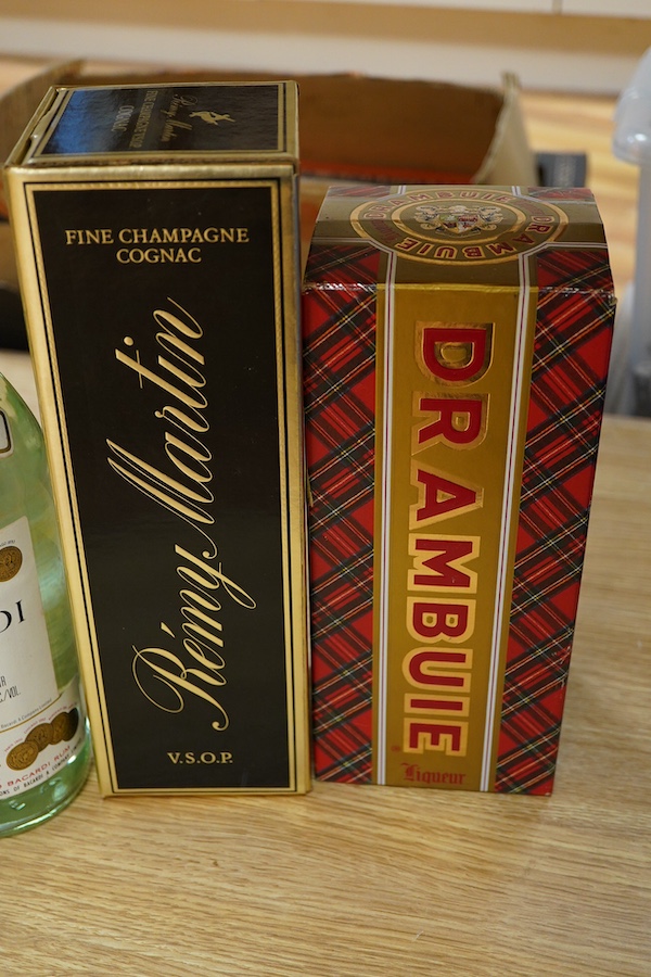 Five bottles of spirits including; Drambuie, Mount Gay Aged Rum, Bacardi, Vladivar Vodka, and Remy Martin Champagne Cognac